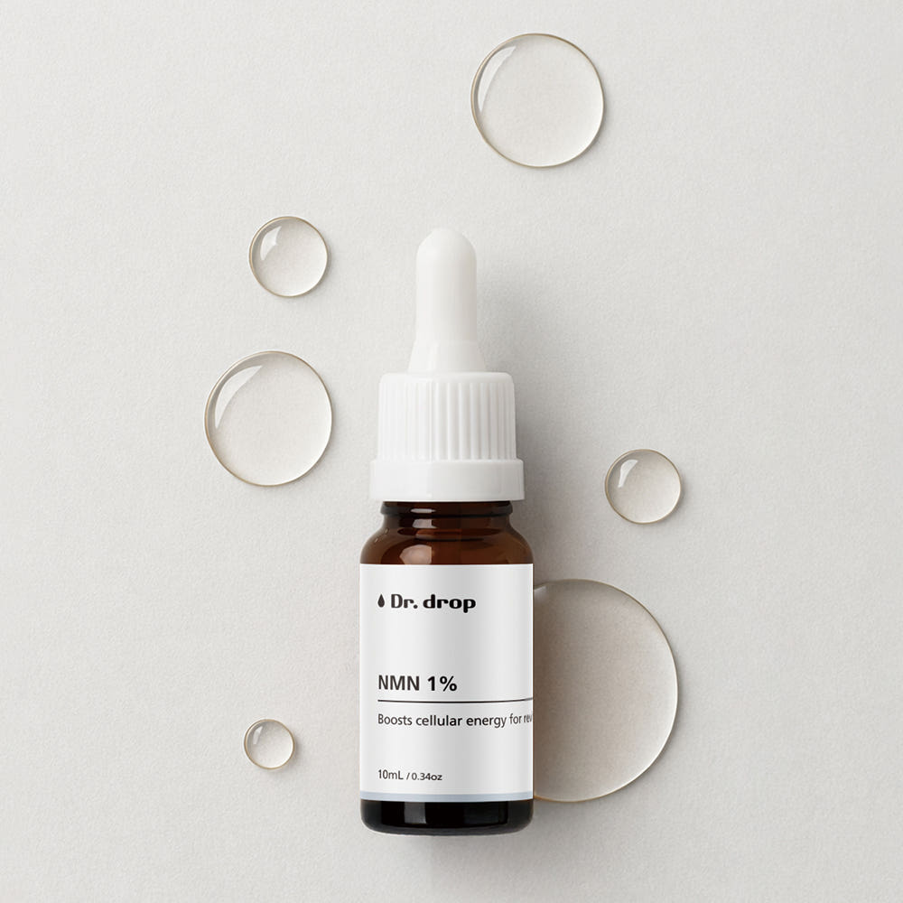 Dr.Drop NMN 1% Powder Ampoule — amber glass dropper bottle with a white cap on a light grey surface